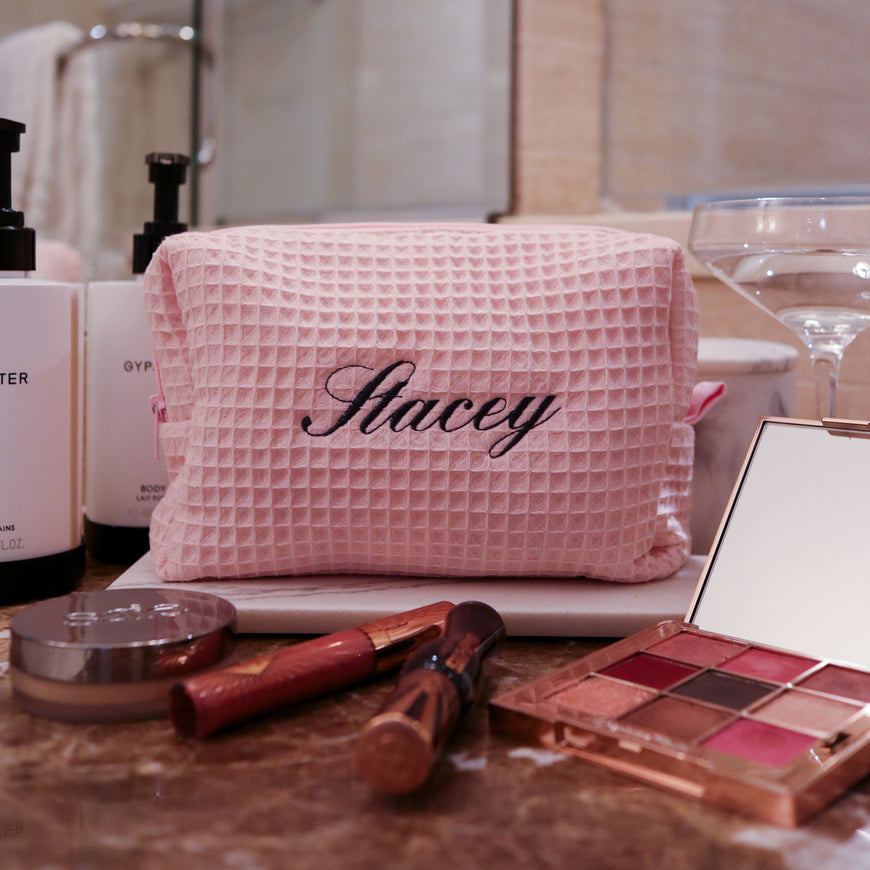 Personalized monogrammed makeup bag with custom embroidery in pink waffle weave fabric