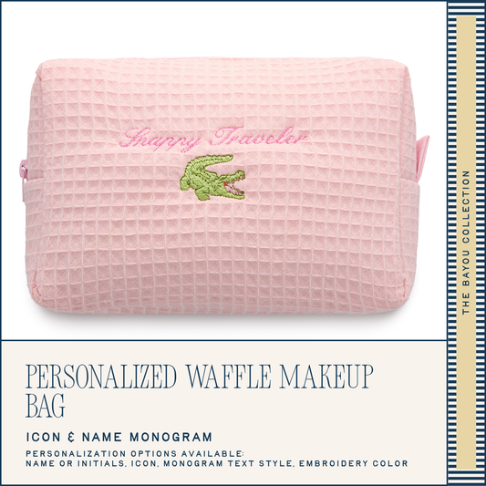 Pink waffle-textured makeup bag with green crocodile logo and 'Snappy Traveler' text on a white background.