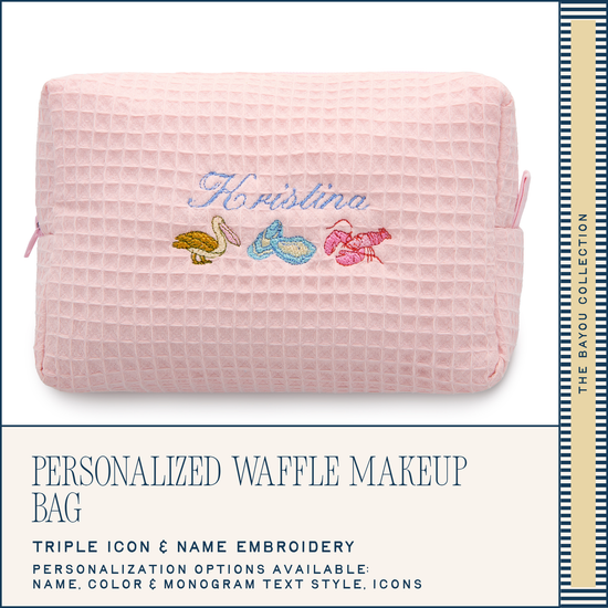 Pink waffle texture makeup bag with embroidered design and text on a white background