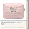 Pink waffle texture makeup bag with 'Emily' and a car icon, on a white background.